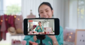 girl filming youtube channel with smart phone